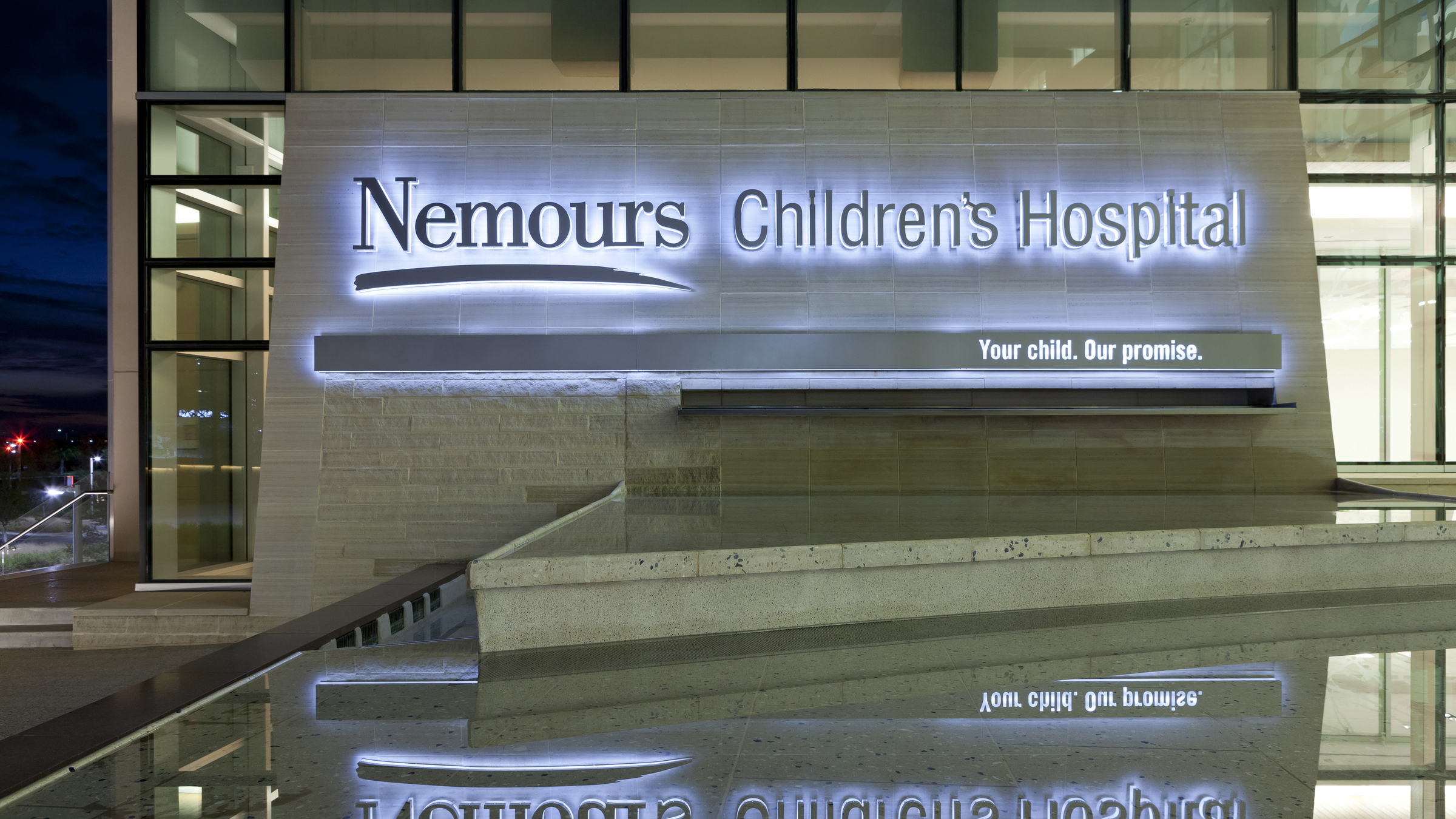 Nemours Children's Hospital fountain sign at night