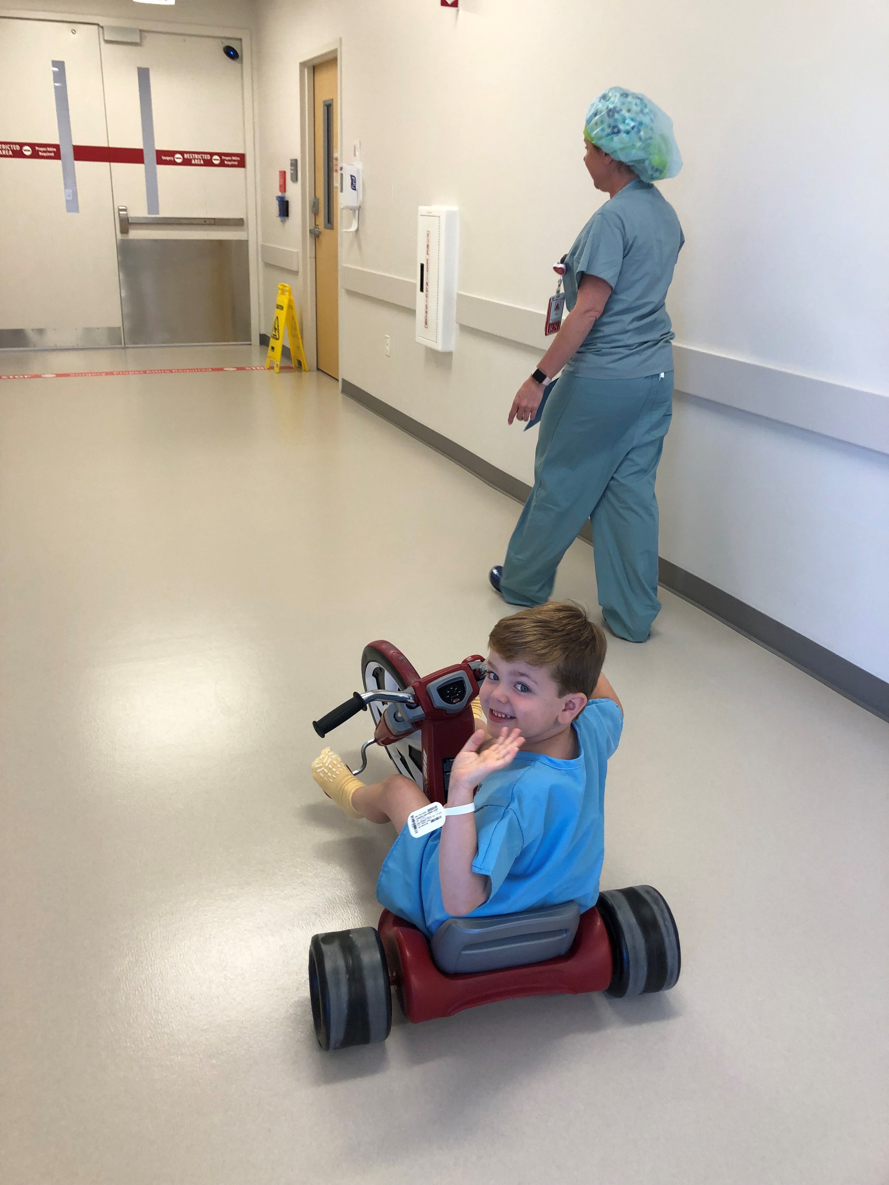 child riding motorcycle into surgery
