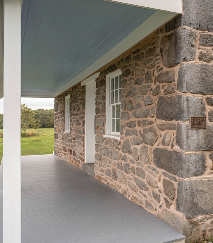 A view across the front porch of the restored Warfield House