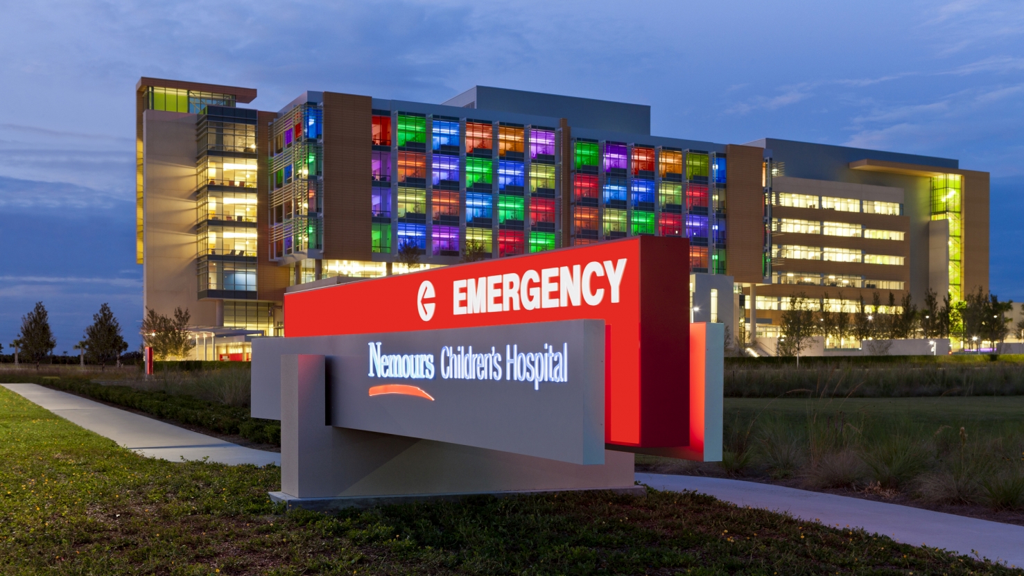 Nemours exterior at night with emergency department sign