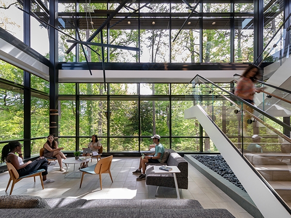 interior shot of wellness center lobby with students interacting in the space