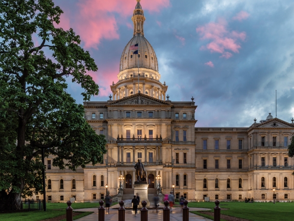 Exterior view of Michigan state capitol at sunset