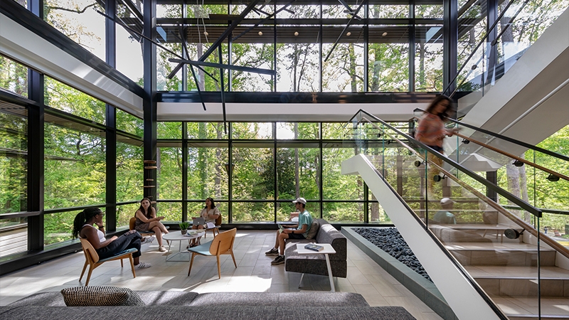 interior shot of wellness center lobby with students interacting in the space