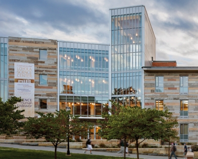 Exterior facade of Loyola Science Center at dusk