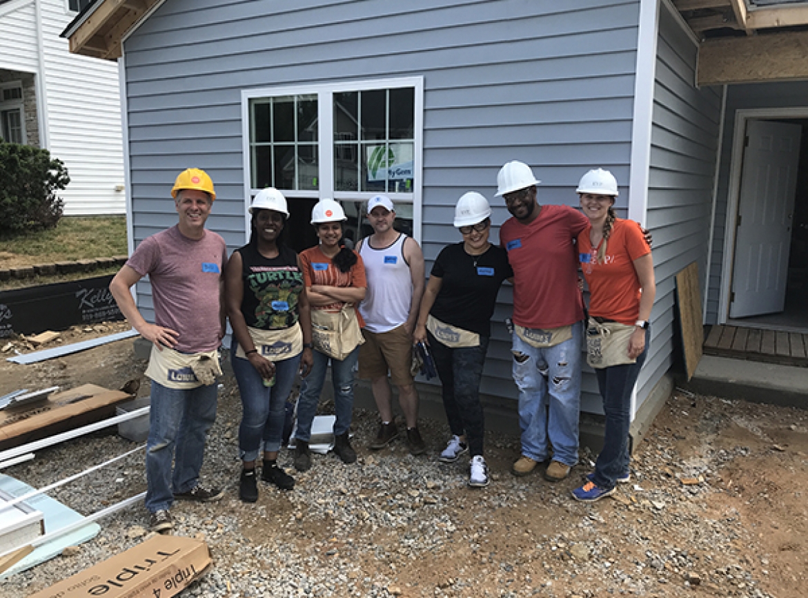 A group of EYP employees working on a Habitat for Humanity house